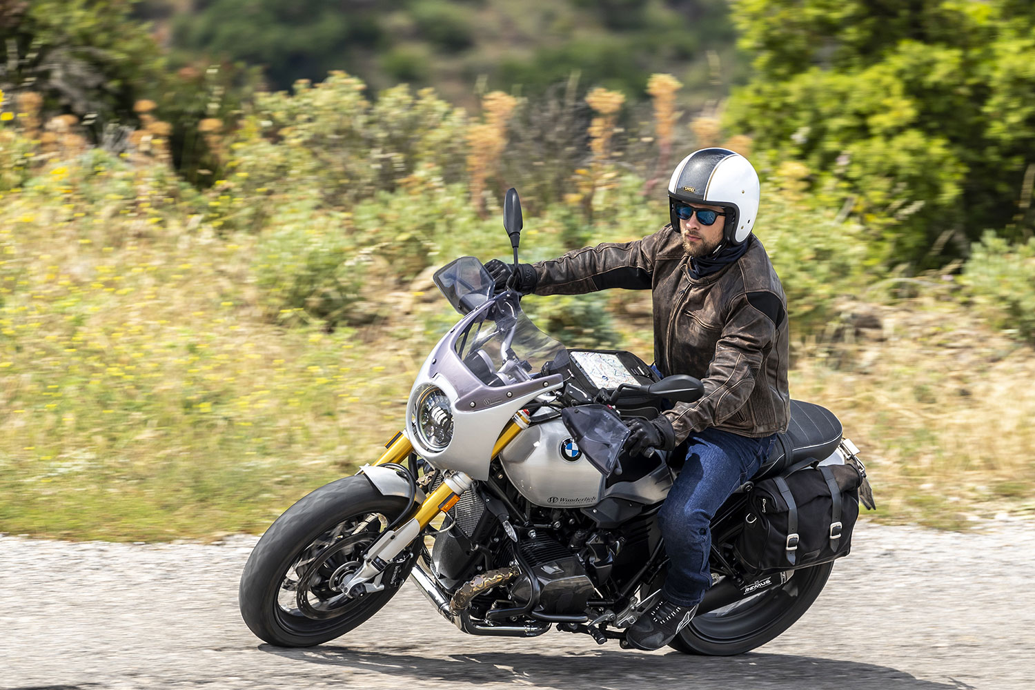 Man riding motorbike wearing roadster leather jacket